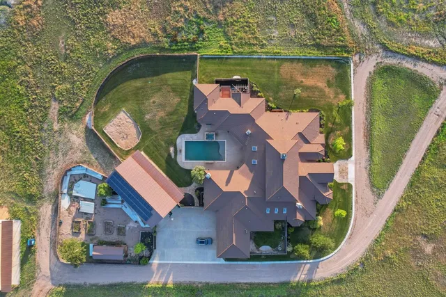 an aerial view of a house with outdoor space lake lake and outdoor seating
