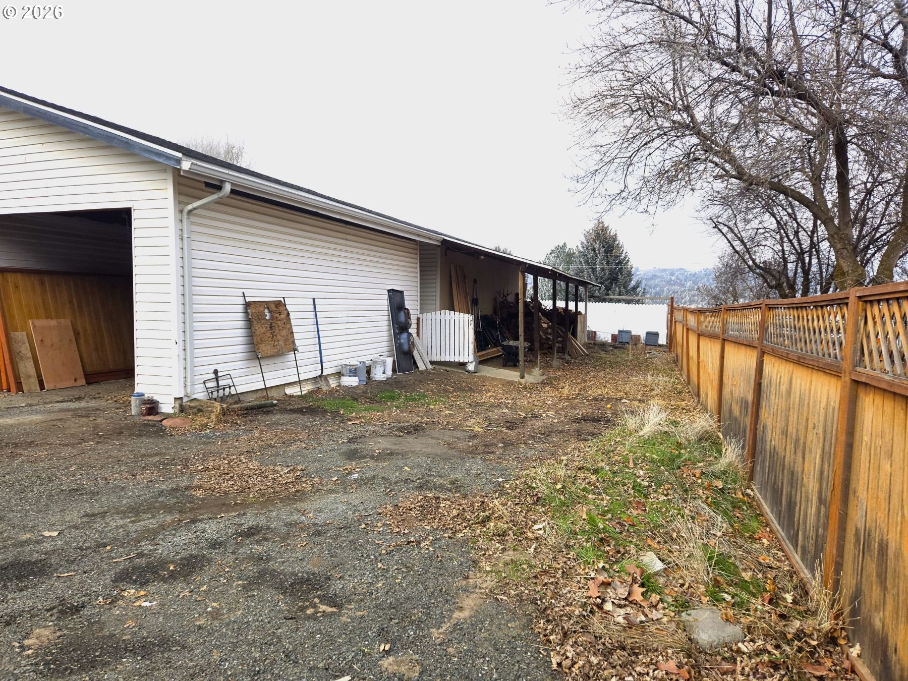 633 Southeast Hillcrest Road John Day, OR 97845 - Photo 13 of 48 a backyard of a house with table and chairs