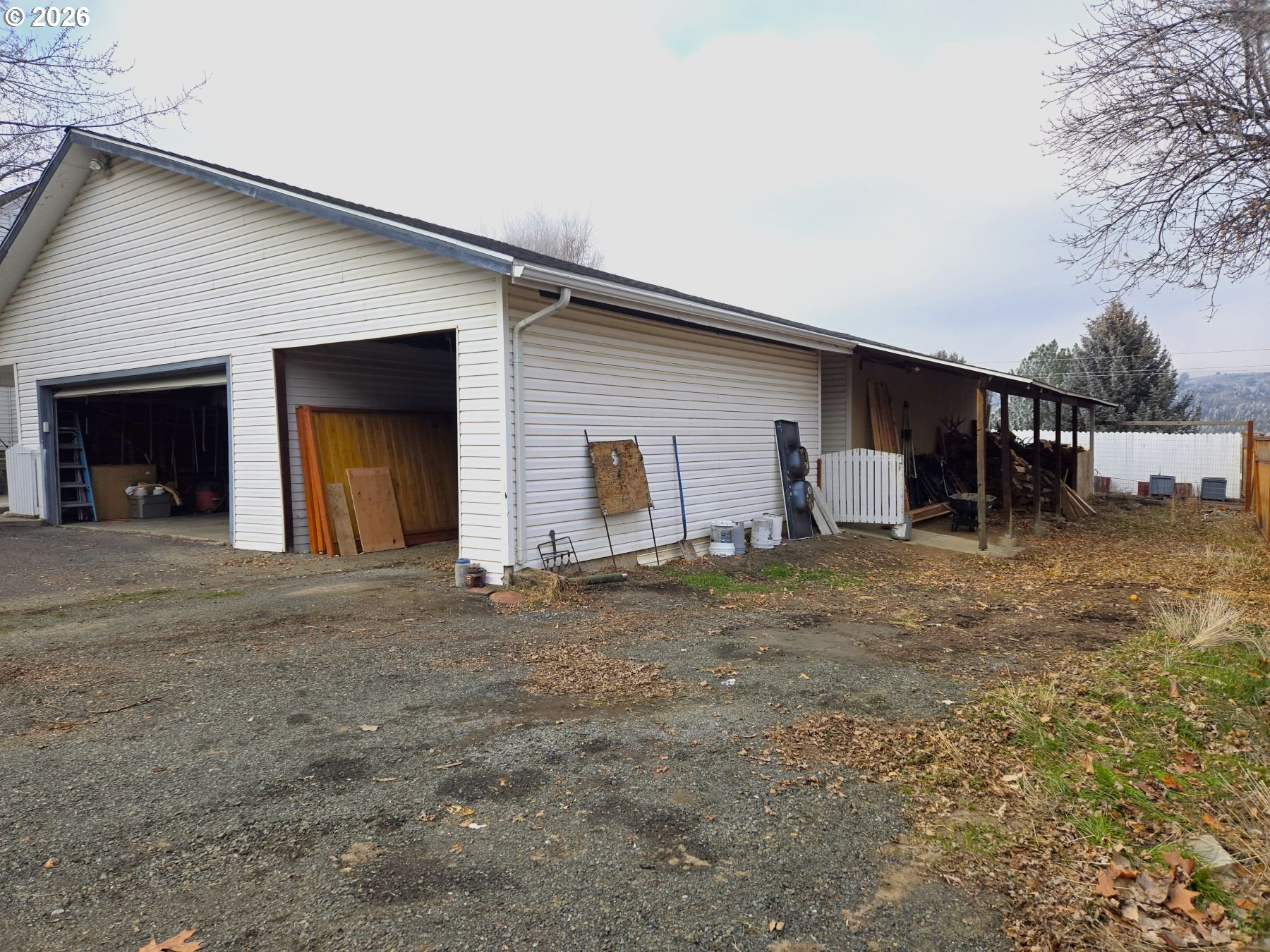 633 Southeast Hillcrest Road John Day, OR 97845 - Photo 16 of 48 a view of a house with a yard and garage