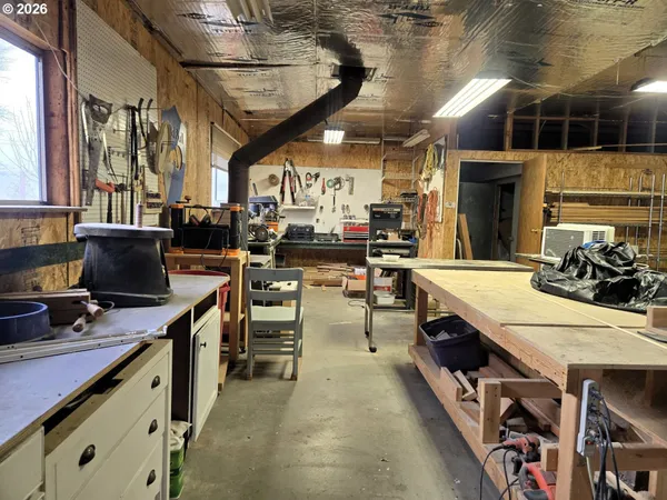 a room with lots of wooden furniture and a equipment