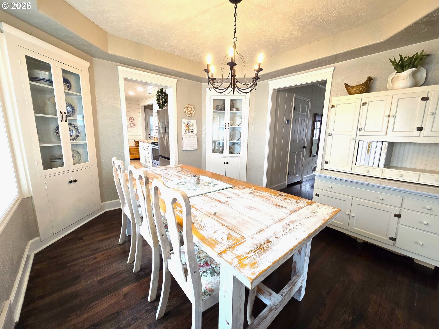 633 Southeast Hillcrest Road John Day, OR 97845 - Photo 26 of 48 a dining room with wooden floor and chandelier