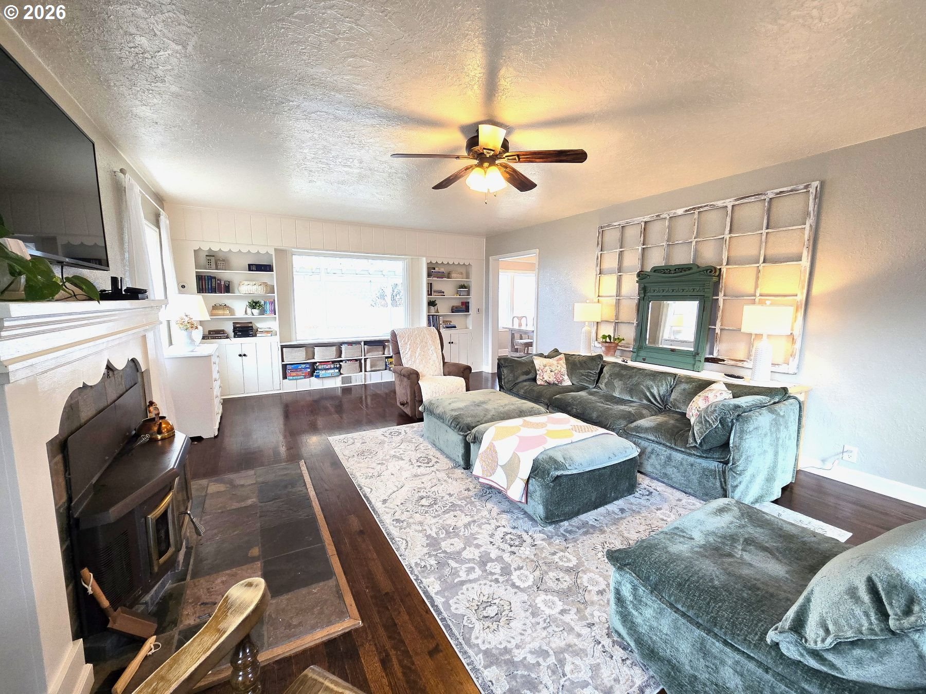 633 Southeast Hillcrest Road John Day, OR 97845 - Photo 31 of 48 a living room with fireplace furniture and a flat screen tv