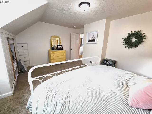 a bed room with a bed and a desk