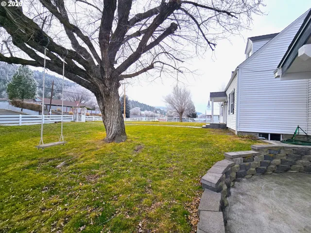 a view of yard with swimming pool