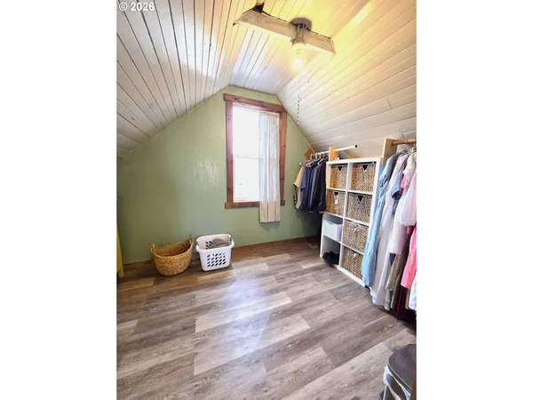 a bedroom with furniture and a book shelf
