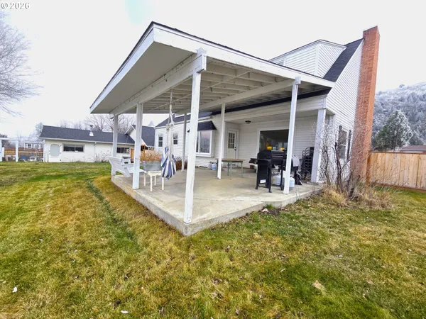a view of a swimming pool with a patio