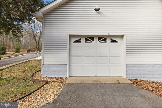 a front view of a house with parking space