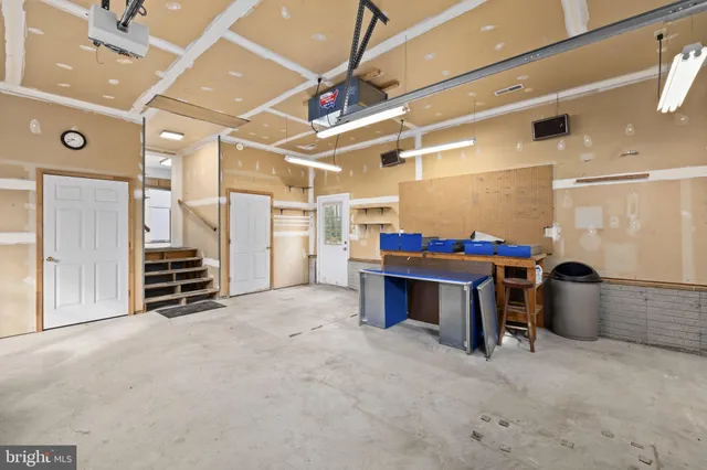 a view of an empty room with furniture