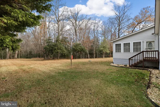 a backyard of a house with lots of green space