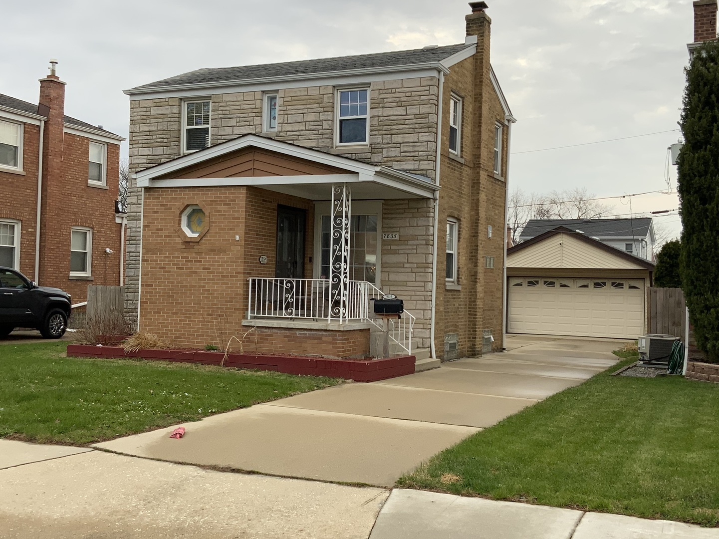 7835 West Berwyn Avenue Chicago, IL 60656 - Photo 1 of 17 a front view of a house with a yard