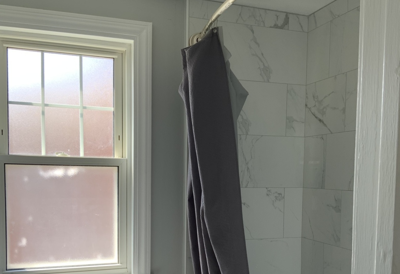 7835 West Berwyn Avenue Chicago, IL 60656 - Photo 11 of 17 a bathroom with a glass shower door