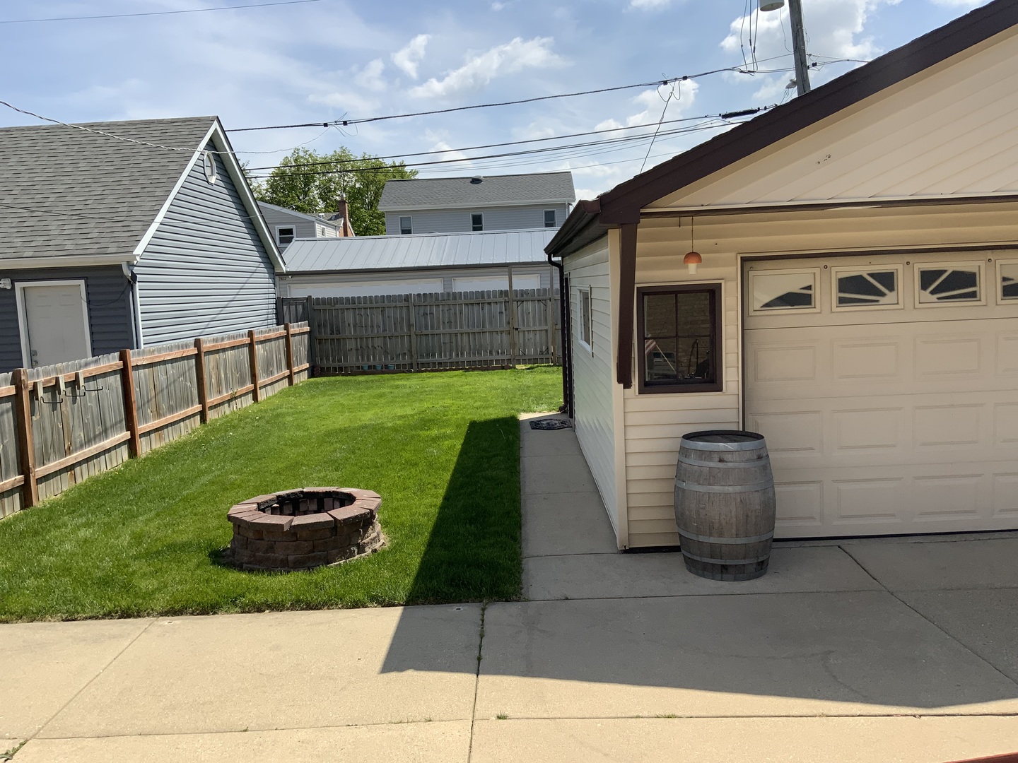 7835 West Berwyn Avenue Chicago, IL 60656 - Photo 16 of 17 a view of a patio with table and chairs with wooden floor and fence