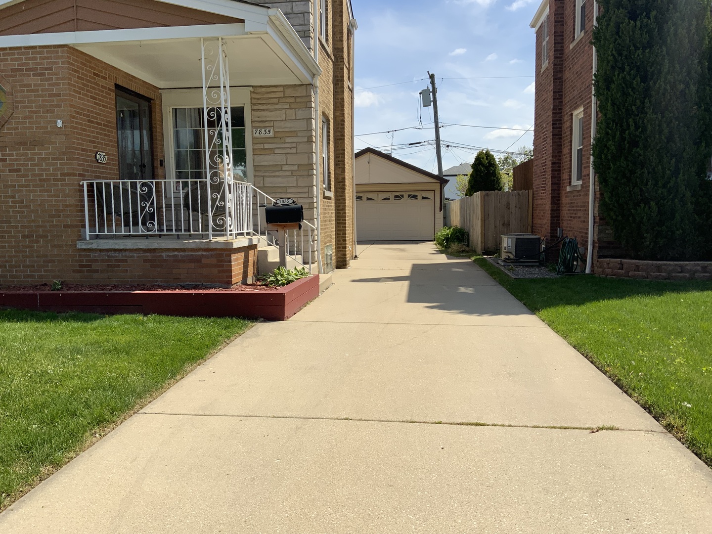 7835 West Berwyn Avenue Chicago, IL 60656 - Photo 2 of 17 a front view of a house with a garden and yard