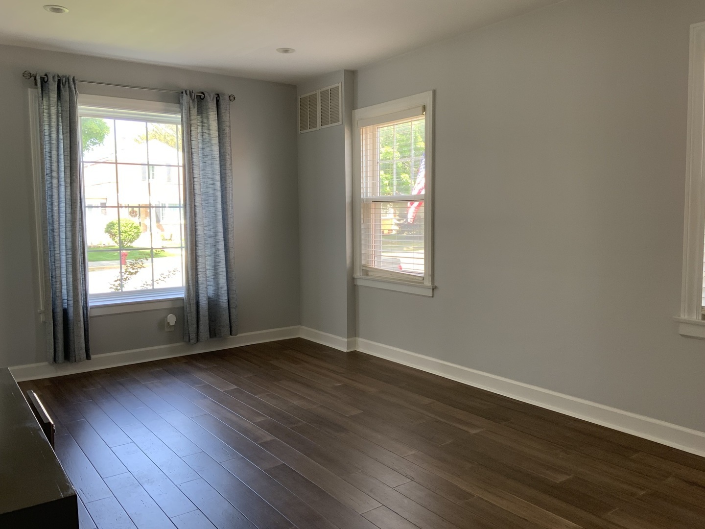 7835 West Berwyn Avenue Chicago, IL 60656 - Photo 9 of 17 an empty room with wooden floor and windows