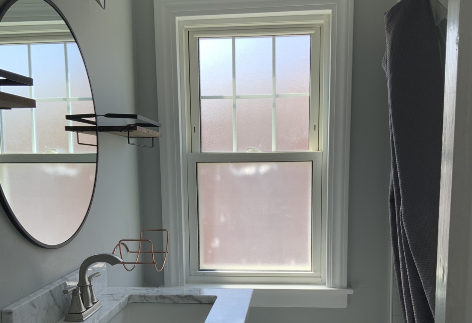 7835 West Berwyn Avenue Chicago, IL 60656 - Photo 10 of 17 a bathroom with a sink and a mirror