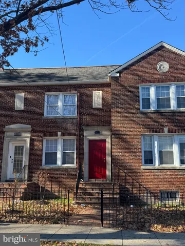a front view of residential houses with street