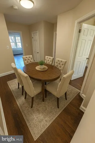 a view of a room with furniture and a table