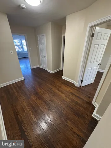 a view of entryway with wooden floor