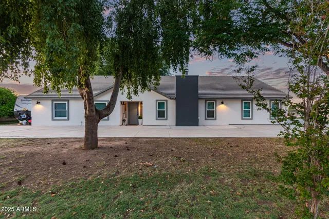 front view of a house with a yard