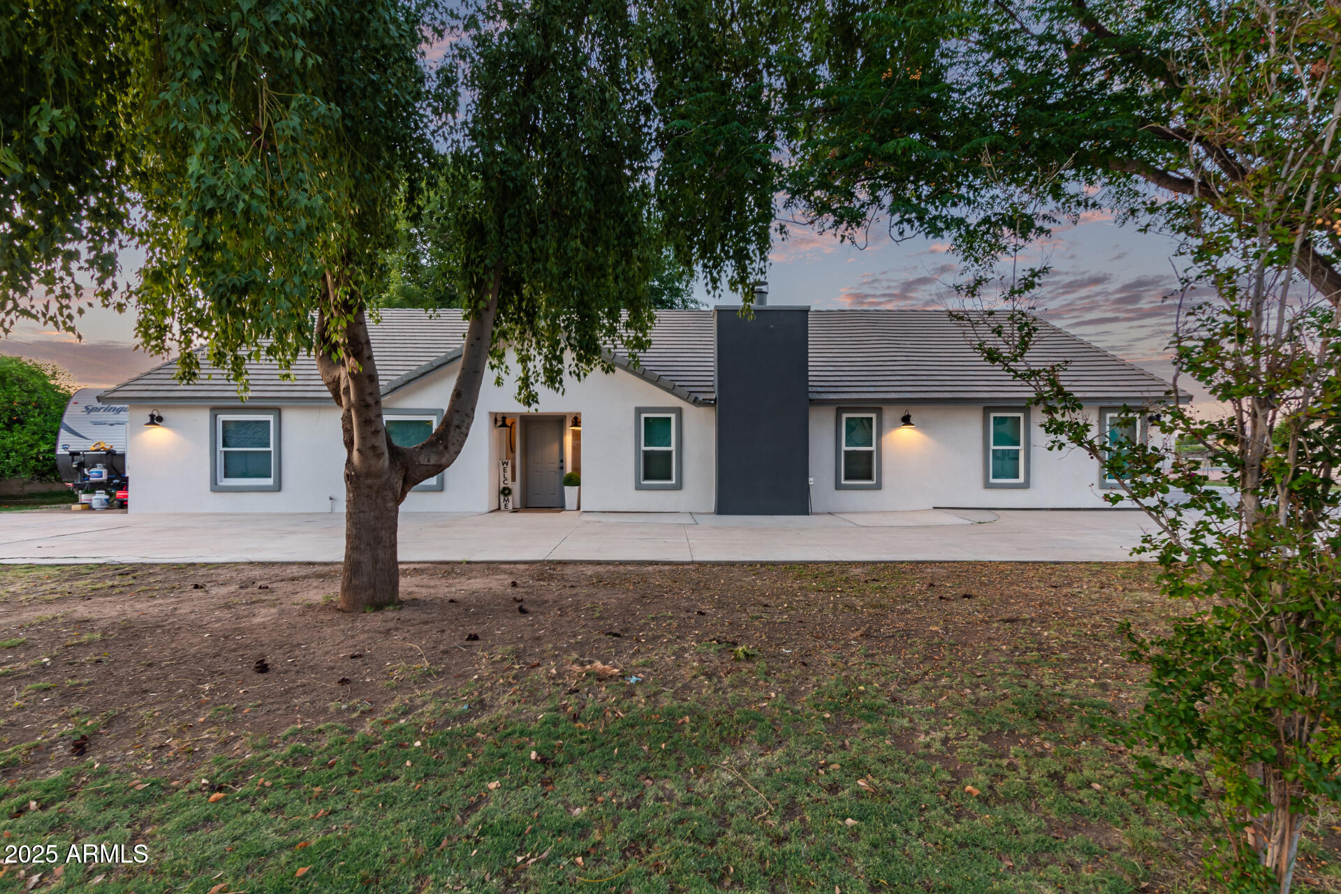 front view of a house with a yard