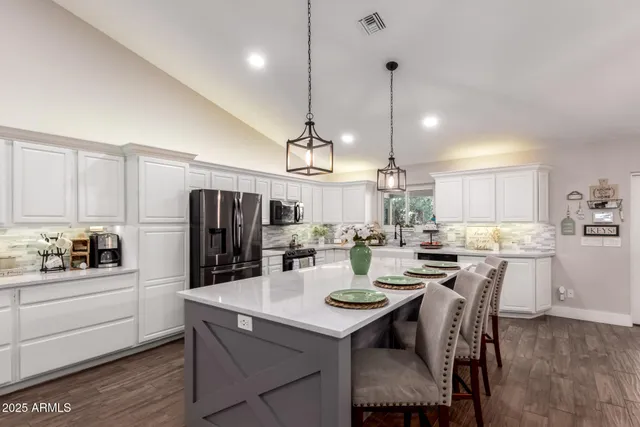 a living room with furniture a air conditioner and a rug