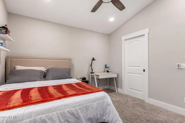 a view of a livingroom with workspace and a window