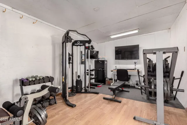 a view of a patio with swimming pool and furniture