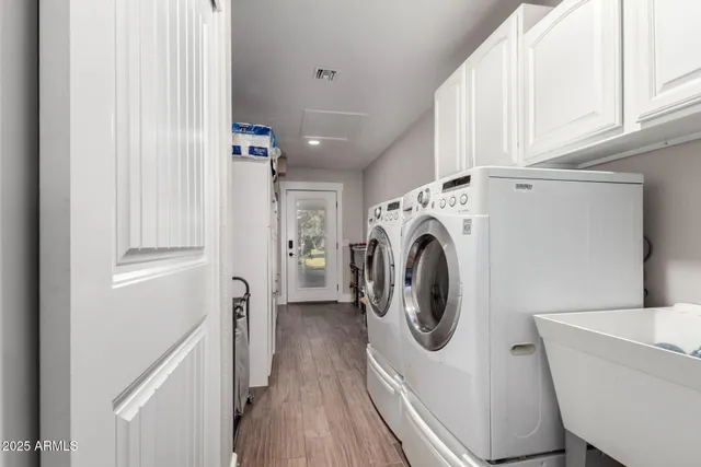 a view of a patio with table and chairs