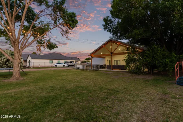 a view of a playground with a tree