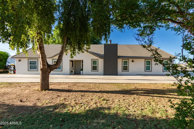 a house with trees in the background