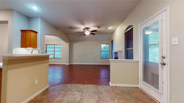 a kitchen with stainless steel appliances granite countertop a refrigerator and a stove top oven