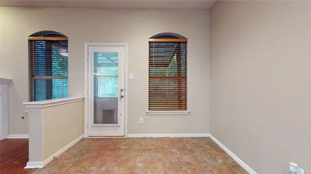 a view of an entryway with front door