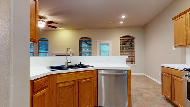 a kitchen with a sink and cabinets