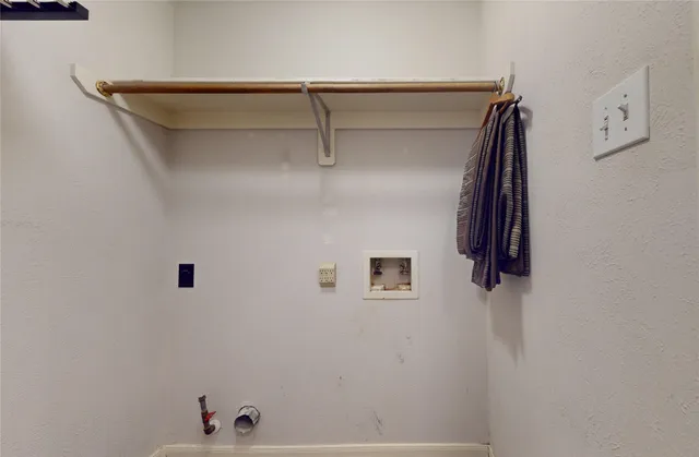 a view of livingroom with chandelier and wooden floor