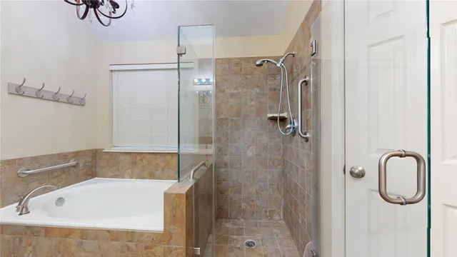 a bathroom with a bathtub and a sink