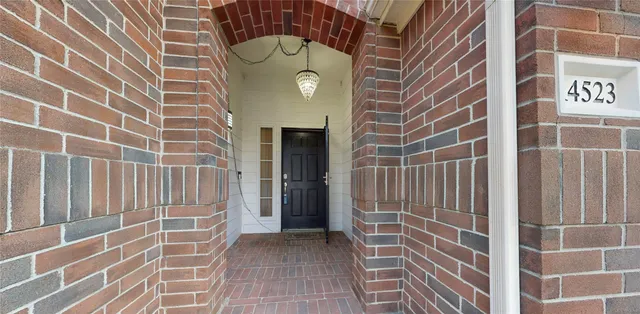 a view of a door with a door and wooden floor