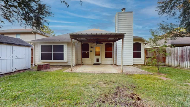 a view of a backyard with a tree