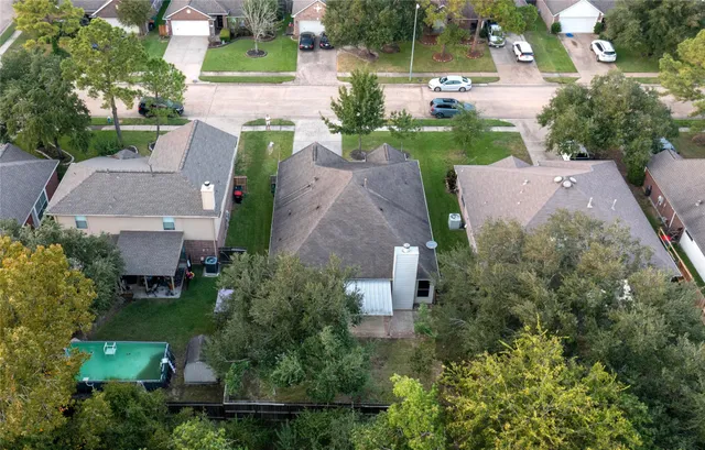 a view of a house with yard and a tree
