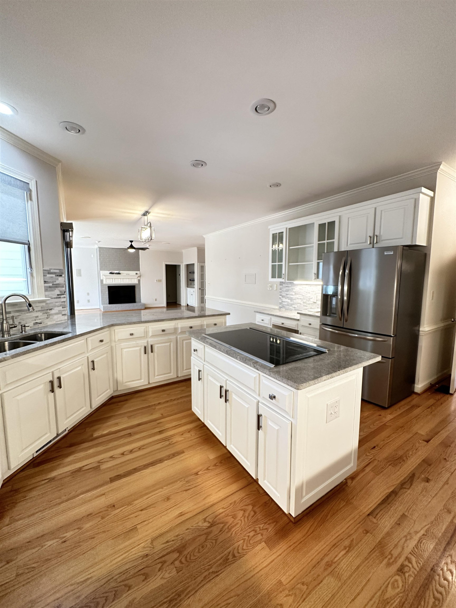 100 Grey Bridge Row Cary, NC 27513 - Photo 11 of 28 a large white kitchen with cabinets and stainless steel appliances