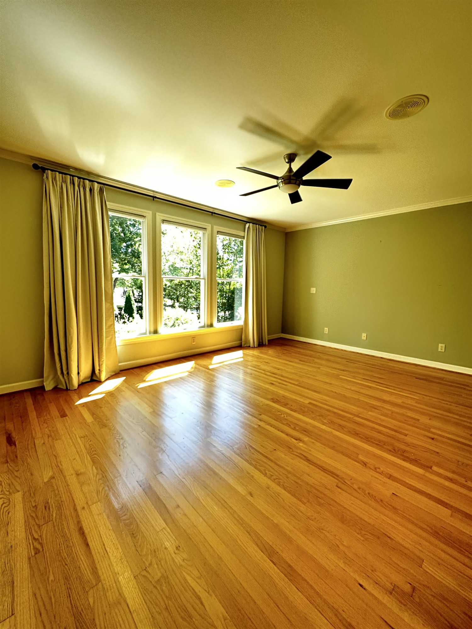 100 Grey Bridge Row Cary, NC 27513 - Photo 12 of 28 an empty room with wooden floor and windows