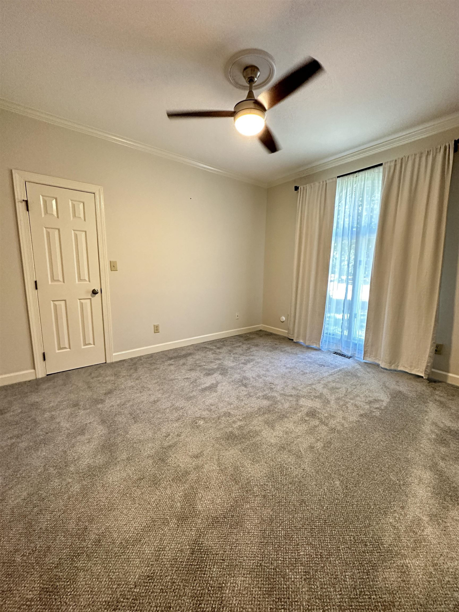 100 Grey Bridge Row Cary, NC 27513 - Photo 16 of 28 an empty room with chandelier fan and windows