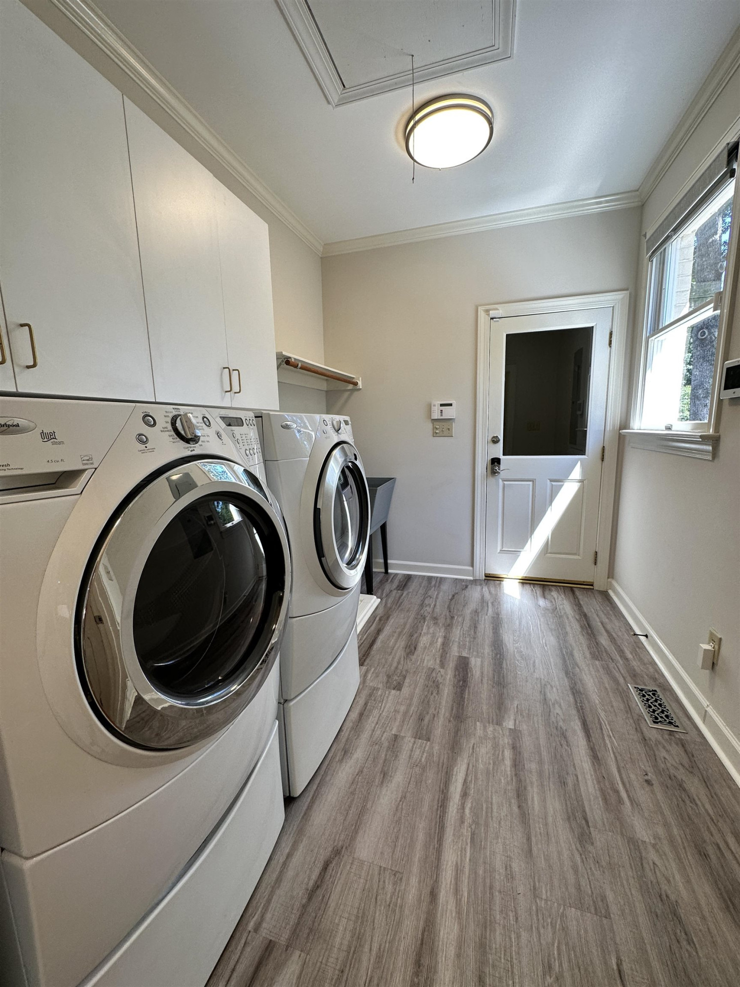 100 Grey Bridge Row Cary, NC 27513 - Photo 23 of 28 a view of a livingroom with washer and dryer