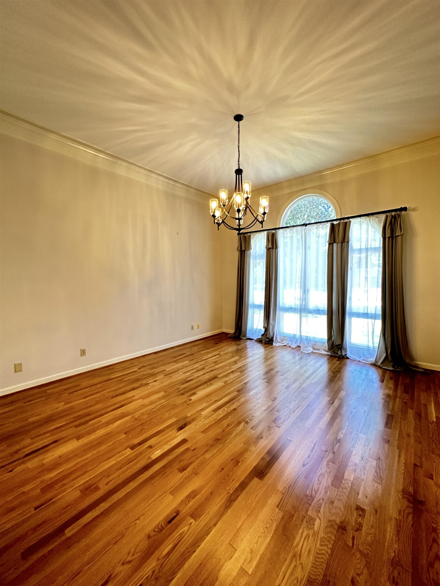 100 Grey Bridge Row Cary, NC 27513 - Photo 5 of 28 a view of a livingroom with wooden floor and a ceiling fan