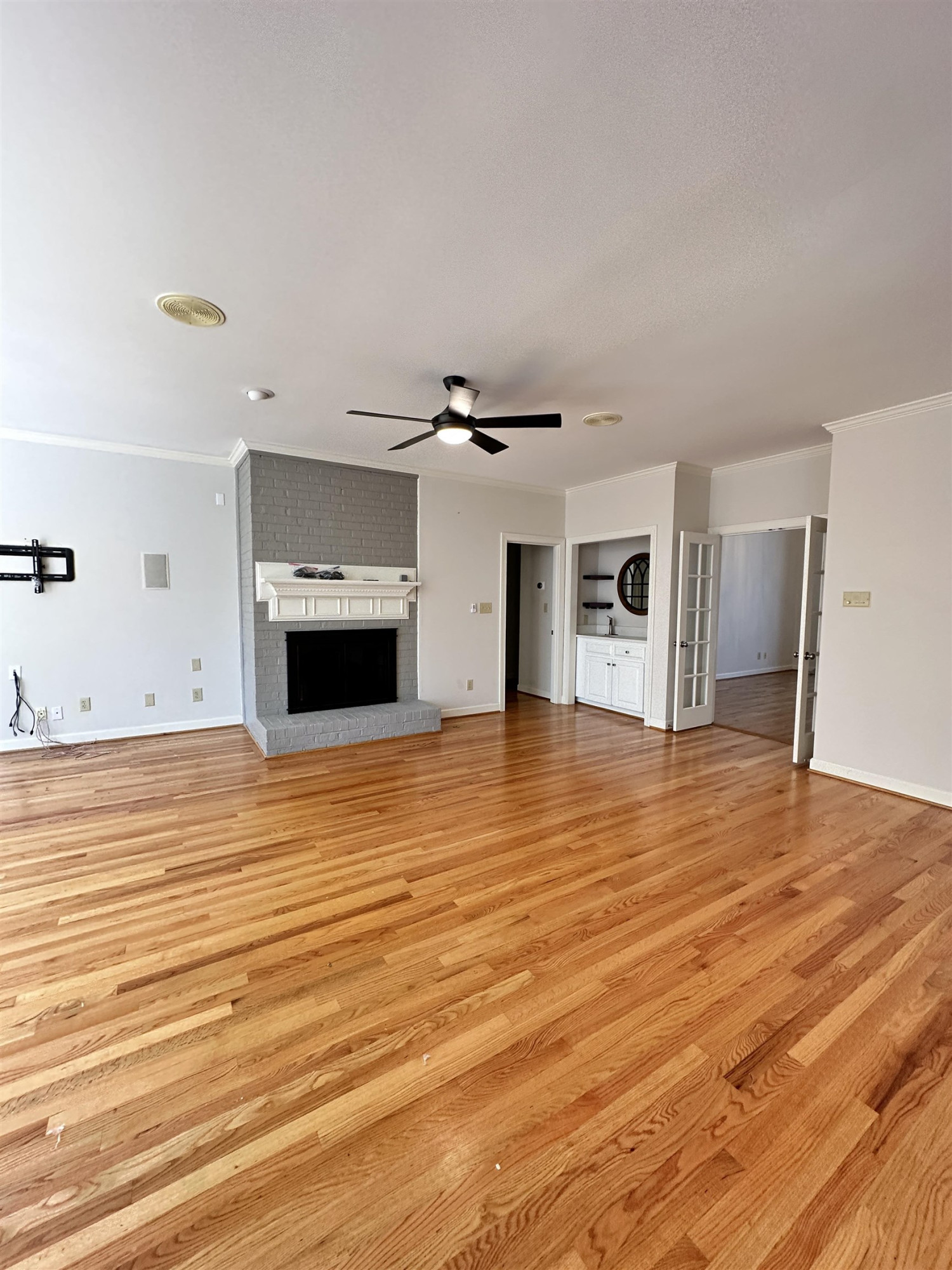 100 Grey Bridge Row Cary, NC 27513 - Photo 6 of 28 a view of empty room with wooden floor and fireplace