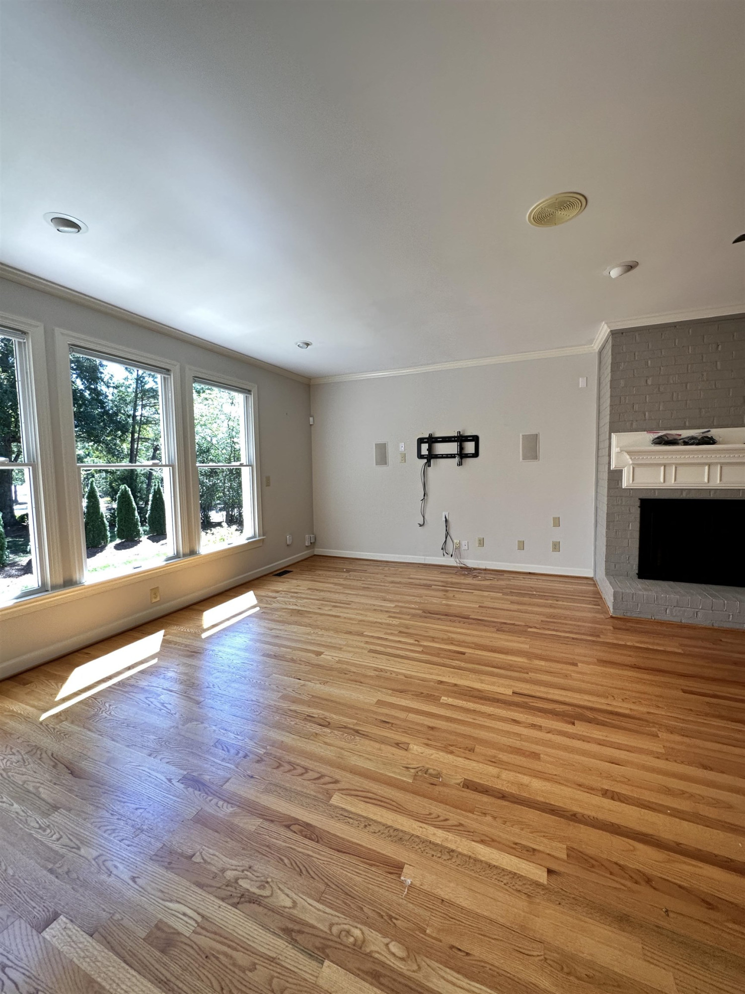 100 Grey Bridge Row Cary, NC 27513 - Photo 7 of 28 a view of empty room with wooden floor and windows