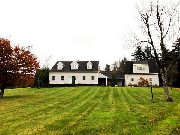 34 West Main Road, Unit L Peru, MA 01235 - Photo 1 of 26 a view of a house with a big yard and large trees