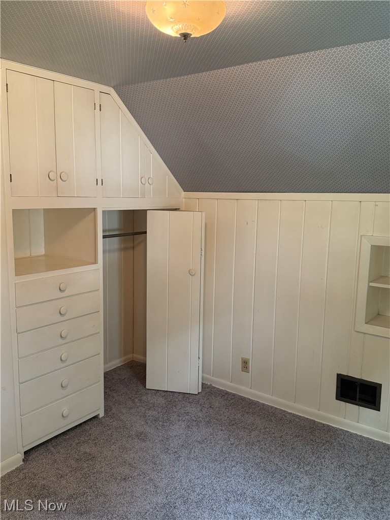 1284 Haverston Road Lyndhurst, OH 44124 - Photo 29 of 43 Additional living space with vaulted ceiling and dark colored carpet