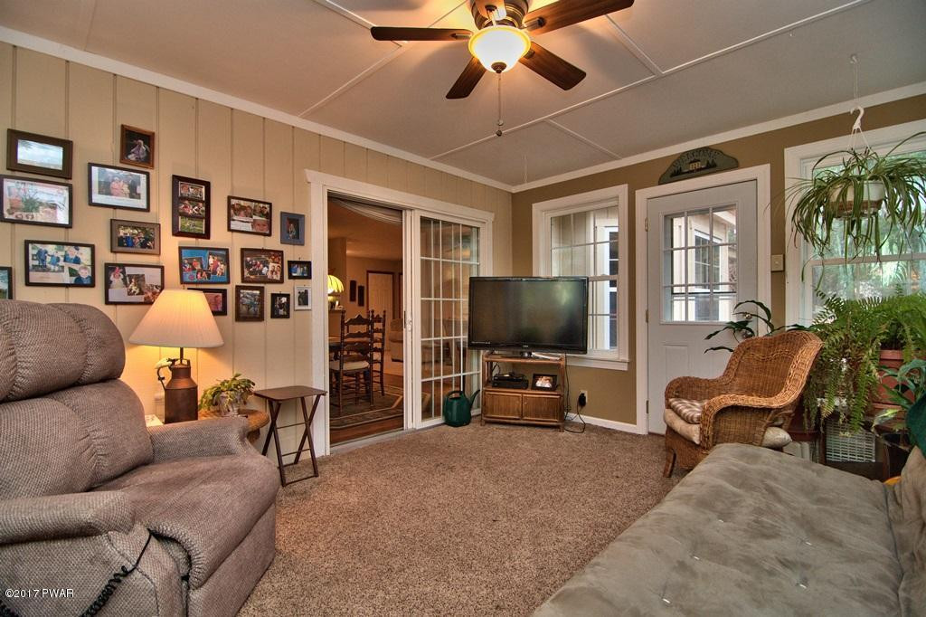 3296 Northgate Road Lake Ariel, PA 18436 - Photo 29 of 33 a living room with furniture and a flat screen tv