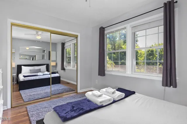 a bedroom with a bed and window