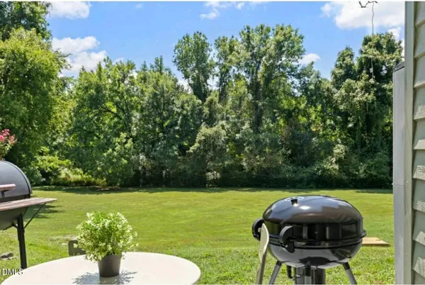 a view of a chairs in a backyard
